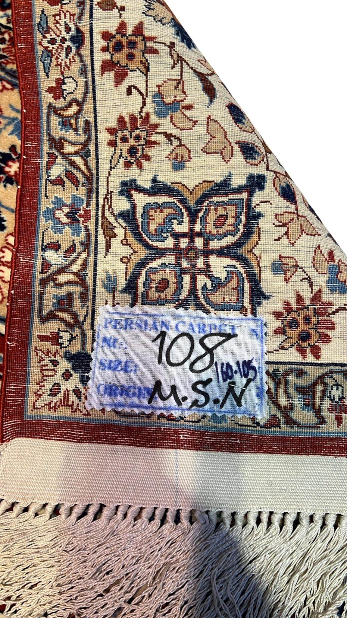 "Backside of a vintage Ahmad Seirafian Persian rug, revealing the intricate hand-knotted silk warp and exceptional craftsmanship."